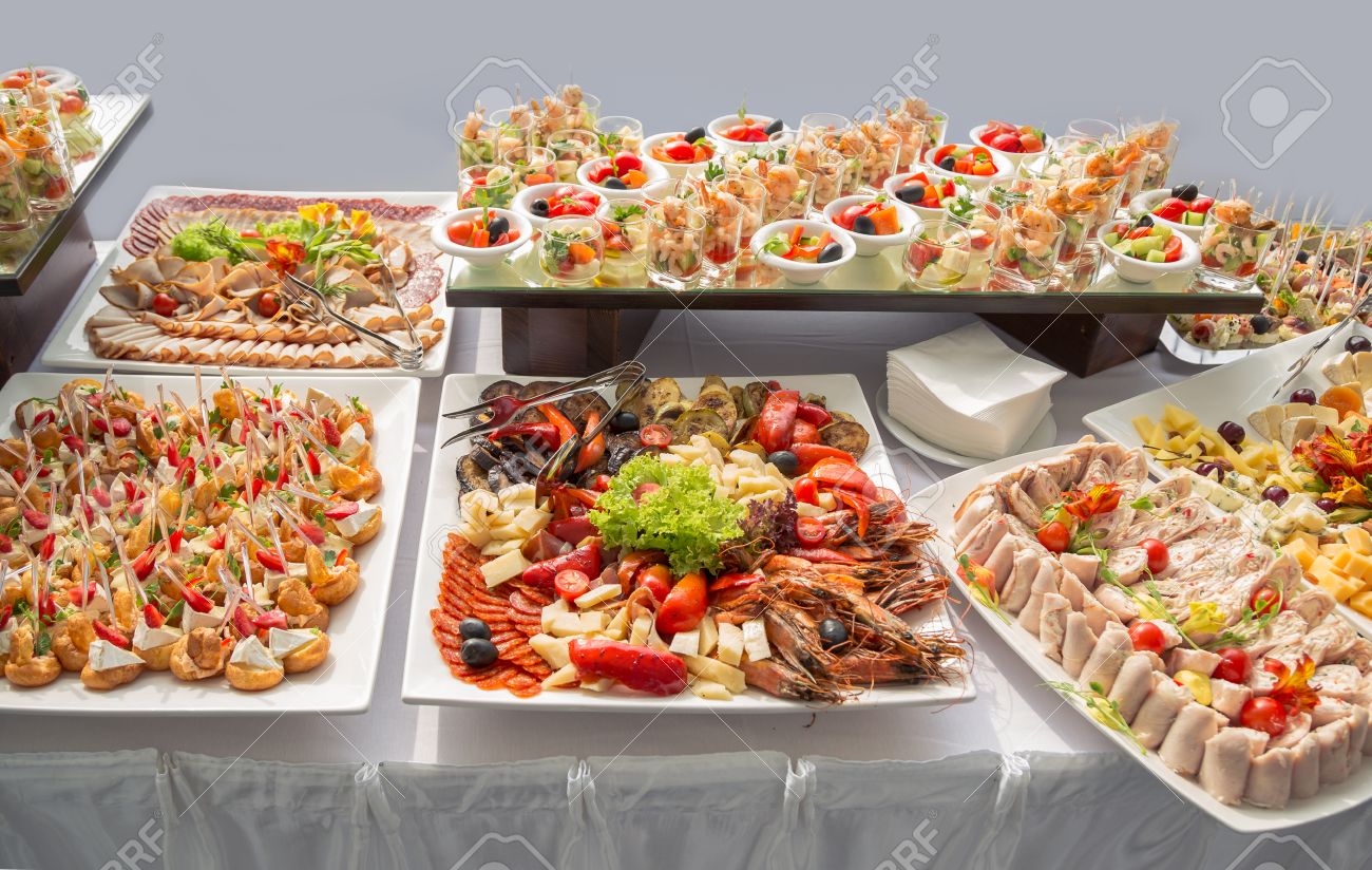 Banquet Table in restaurant served with different meals.