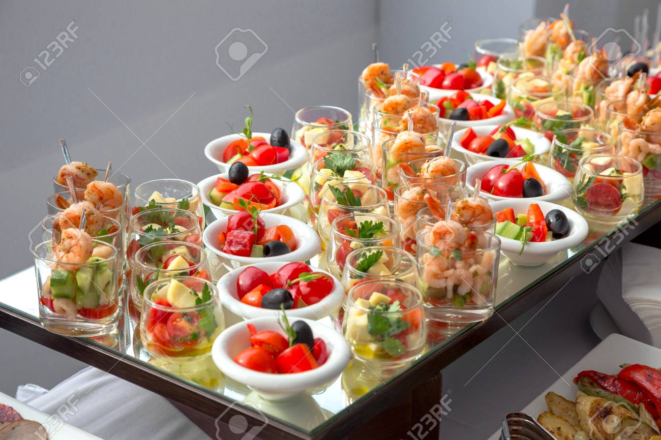 Banquet Table in restaurant served with different meals.