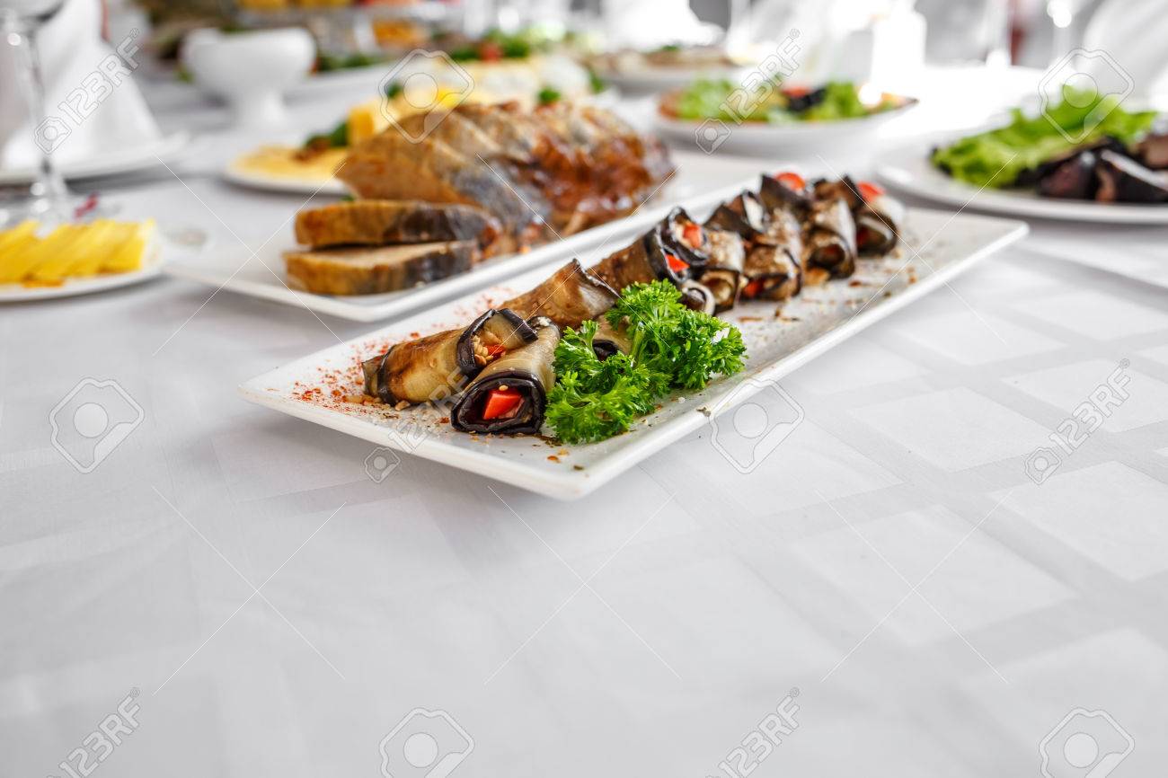 Banquet Table in restaurant served with different meals.